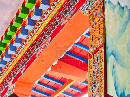 Photo for LA BOULAYE, FRANCE - APRIL Circa, 2018. Colored architectural details and traditional colorful paintings of a tibetan temple, called one thousand buddhas temple. Many Thangka paintings, wall frescoes and friezes - Royalty Free Image