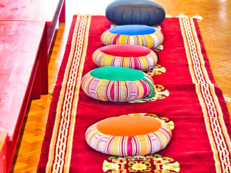 Photo for Colorful monk's prayer or meditation cushions in the temple. Waiting for people - Royalty Free Image