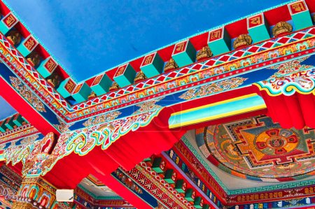 Photo for LA BOULAYE, FRANCE - APRIL Circa, 2018. Colored architectural details and traditional colorful paintings of a tibetan temple, called one thousand buddhas temple. Many Thangka paintings, wall frescoes and friezes - Royalty Free Image
