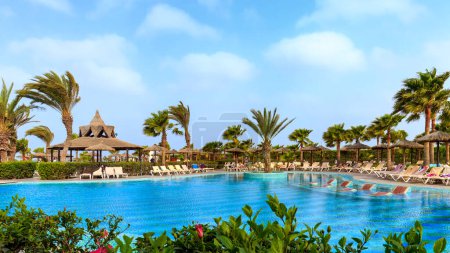 Heated pool with steam, clear waters, and a lively bar at Riu Karamboa, Boa Vista, cape Verde