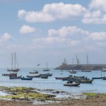  Boa Vista, Cape Verde- March 22, 2018: A peaceful harbor scene with colorful boats in Sal Rei serene waters