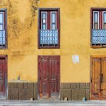 Boa A yellow house with simple doors and balconies captures Sal Reis spirit: Traditional Architecture in Sal Rei, Cape Verde. High quality photo