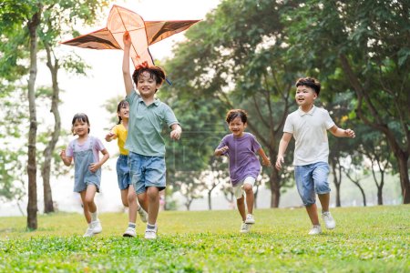 Foto de Group image of cute asian children playing in the park - Imagen libre de derechos
