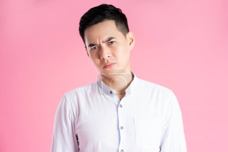 Photo for Portrait of asian man posing on pink background - Royalty Free Image