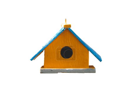 Wooden birdhouse on white background, handmade nest for small birds in nature