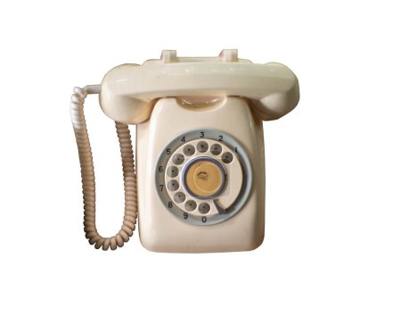 Isolated vintage rotary telephone on white background