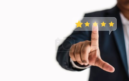 Photo for The idea of rating placement. Businessman examining technology on a blue background with a five-star rating, concept of service performance, quality, and satisfaction.area for copy in a web banner. - Royalty Free Image