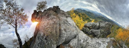 The Sokilsky ridge in the Carpathians is especially beautiful in autumn. its ancient cliffs among beech and birch forests are mesmerizing from a bird's eye view