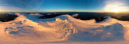 Carpathians, Ukraine, high-mountain ancient Polish observatory on Mount Pip Ivan, Black Mountain overgrown with ice and snow over the winter, a group of mountain rescuers live inside drone flight, panorama view from above