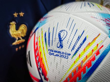 Photo for Loriol sur Drome , France - 10 November 2022: Official World Cup Football Ball Al Rihla. And logo of FIFA World Cup in Qatar 2022 with a rooster that appears on the jersey of the French football team - Royalty Free Image