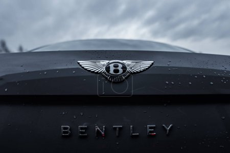 Photo for Bentley logo Flying B on the car. Bentley Motors Limited is a British manufacturer of luxury automobiles - Royalty Free Image