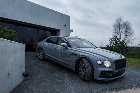 Photo for 2022 Bentley Flying Spur V12. Third generation Flying Spur close up view at the private villa. - Royalty Free Image