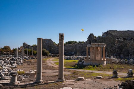 Photo for View of old ruined ancient temple of Tyche with clear blue sky in the background during sunny day at Side, Turkey - Royalty Free Image