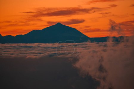 Photo for Spectacular sunset above the clouds of the Teide volcano national park on Tenerife. Sunset from the top of Gran Canaria Island. Pico de las Nieves. - Royalty Free Image