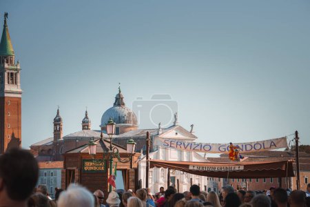 Photo for Tourists exploring the Patriarchal Cathedral Basilica of Saint Mark at the Piazza San Marco. St Mark s Square, Venice, Italy - Royalty Free Image