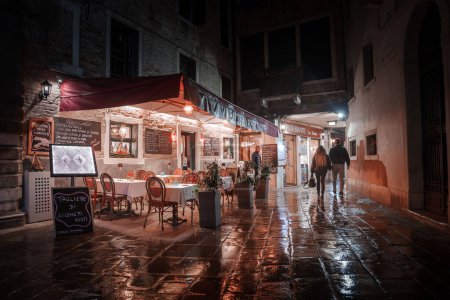 Photo for Experience the enchanting atmosphere of a rainy night in Venice, Italy. This moody and mysterious image captures the iconic canals and architecture, evoking a sense of romance and intrigue. - Royalty Free Image