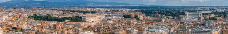 An aerial panorama of Rome shows terracotta rooftops and green canopies, blending ancient and modern architecture.