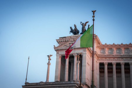 Photo for Neoclassical building in Italy showcasing Italian flag, statues, intricate details, clear sky. Grand architectural design with historical significance. - Royalty Free Image