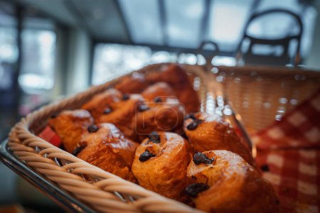 Photo for Close up view of freshly baked chocolate chip brioche buns in a golden brown crust, studded with dark chocolate chips. Location Zermatt, Swiss ski resort. - Royalty Free Image