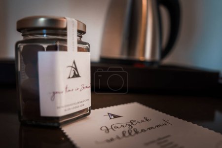 Photo for Close up view of luxury hotel amenity featuring a logo of mountain peak in Zermatt, Switzerland. Personalized welcome label and note add a warm touch. - Royalty Free Image