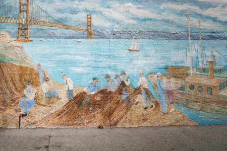 Photo for Colorful mural illustrating maritime scene with figures in blue and white clothing near Golden Gate Bridge in San Francisco. Bay, sailboats, clear sky. - Royalty Free Image