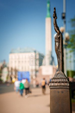 Photo for A miniature bronze sculpture of the monument of freedom Milda in Riga, Latvia. - Royalty Free Image