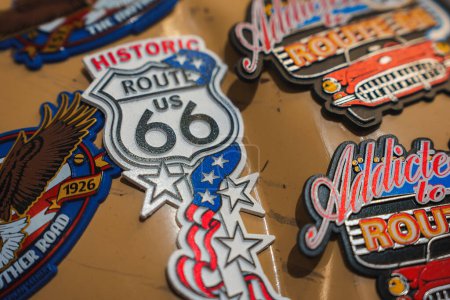 Photo for Colorful magnets themed around Historic Route 66, featuring iconic designs like road signs, eagles, and classic cars. Perfect souvenirs from Williams, Arizona. - Royalty Free Image