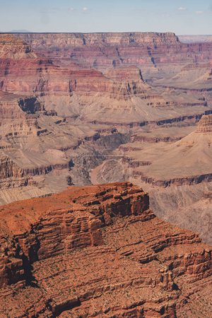Experience the awe inspiring beauty of the Grand Canyon in Arizona, USA. This captivating shot showcases the intricate layers and vastness of the iconic geological wonder.