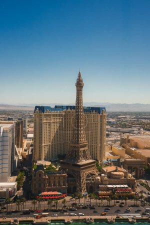 Photo for Aerial view of Paris Las Vegas Hotel with Eiffel Tower replica on Las Vegas Strip. French themed architecture stands out amid vibrant cityscape. Sunny Nevada weather captured. - Royalty Free Image