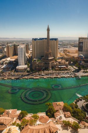 Photo for Aerial view of the Las Vegas Strip featuring Bellagio Hotels fountains, Paris Las Vegas Hotel with Eiffel Tower replica, and cityscape against the desert backdrop. - Royalty Free Image