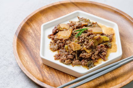 Photo for Bulgogi, korean food, Bulgogi is prepared with beef that has been marinated in soy sauce, honey, minced green onion, garlic, sesame seeds, and pepper, and then grilled. The excess liquid can be mixed with rice, which tastes as good as the bulgogi its - Royalty Free Image