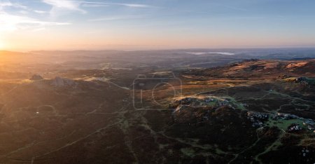 Photo for An aerial landscape view of Haytor Rocks in The Dartmoor National Park in Devon at sunrise - Royalty Free Image