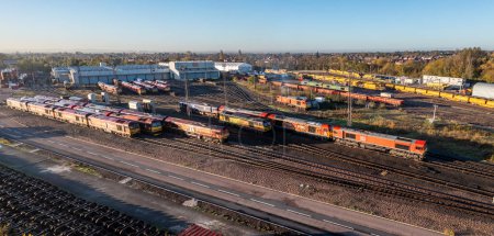 Photo for TOTON, NOTTINGHAM, UK - NOVEMBER 4, 2022.  An aerial view of DB Schenker's Toton TMD with railway locomotive and wagons ready for repair and fueling - Royalty Free Image
