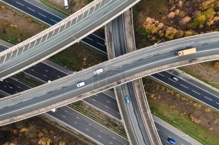 Photo for An aerial view above a complex motorway junction with slip roads and overbridges connecting the M62 and A1 motorways in the UK - Royalty Free Image