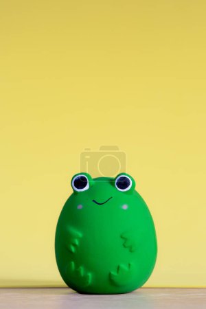 Foto de A generic and happy frog soft toy to teach small children about wildlife and nature with copy space - Imagen libre de derechos