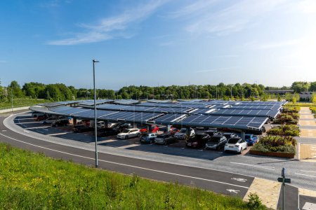 Photo for LEEDS, UK - MAY 25, 2023.  A self sufficient parking lot with park and ride facilities and solar panels for electric car charging in an innovative technology concept - Royalty Free Image