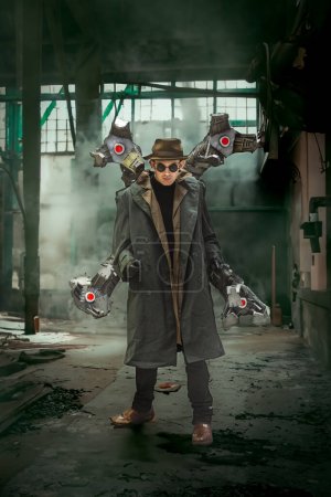 Photo for A portrait of a male cosplay dressed as Doc Ock or Doctor Otto Octavius an enemy of the Superhero Spiderman in a deserted warehouse - Royalty Free Image
