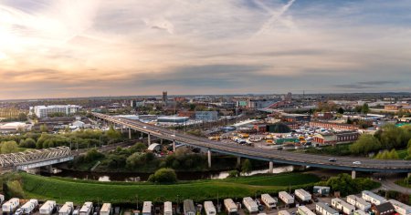 Aerial landscape view of Doncaster cityscape skyline with rail and road transport links serving the South Yorkshire city centre with travellers caravan park