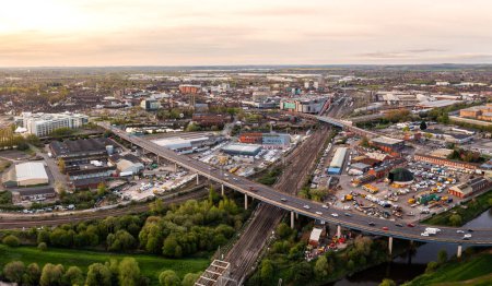 Aerial landscape view of Doncaster cityscape skyline with rail and road transport links serving the South Yorkshire city centre at sunrise