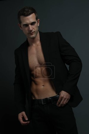 Sexy Male Model wearing black suit jacket