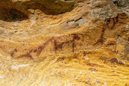 Photo for Discovering the Ancient Red Ochre Paintings on the Stones of Jebel Ousselat in Central Tunisia - Royalty Free Image