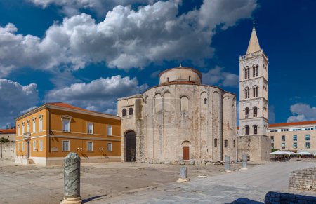 Zadar, Croatia - The Roman Forum of the old city of Zadar with the Church of St. Donatus and the bell tower of the Cathedral of St. Anastasia taken on a bright summer day with blue sky and clouds