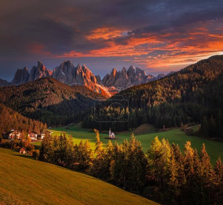 Photo for Val Di Funes, Dolomites, Italy - The beautiful St. Johann Church (Chiesetta di San Giovanni in Ranui) at South Tyrol with the Italian Dolomites and colorful golden sunset sky at background - Royalty Free Image