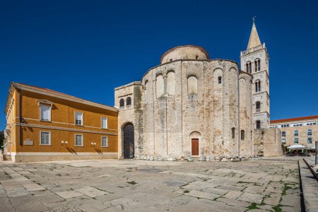 Photo for Zadar, Croatia - The Roman Forum of the old city of Zadar with the Church of St. Donatus and the bell tower of the Cathedral of St. Anastasia taken on a bright summer day with clear blue sky - Royalty Free Image