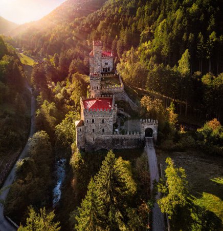 Photo for Latzfons, Italy - Aerial view of sunrise at beautiful Gernstein Castle (Castello di Gernstein, Schloss Gernstein) in South Tyrol at summer time with green foliage and sunrays - Royalty Free Image