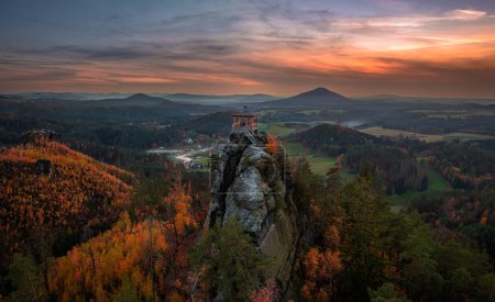 Photo for Jetrichovice, Czech Republic - Aerial panoramic view of Mariina Vyhlidka (Mary's view) lookout with a beautiful Czech autumn landscape and colorful golden sunset sky in Bohemian Switzerland region - Royalty Free Image