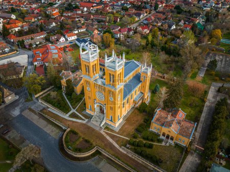 Photo for Fot, Hungary - Aerial view of the Roman Catholic Church of the Immaculate Conception (Szeplotlen Fogantatas templom) in the town of Fot on a sunny spring day - Royalty Free Image