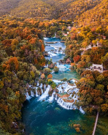 Photo for Krka, Croatia - Aerial panoramic view of the beautiful Krka Waterfalls in Krka National Park on a bright autumn morning with colorful autumn foliage and turquoise blue water - Royalty Free Image