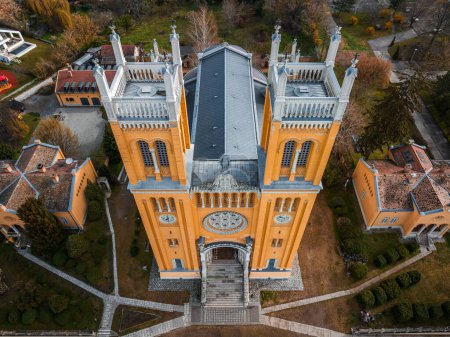 Photo for Fot, Hungary - Aerial view of the Roman Catholic Church of the Immaculate Conception (Szeplotlen Fogantatas templom) in the town of Fot on a sunny spring day - Royalty Free Image