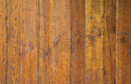 Photo for Texture of the old wooden wall from a number of scratched planks that are varnished - Royalty Free Image